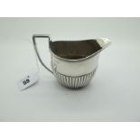 A Hallmarked Silver Jug, JBC, London 1891, of oval semi reeded form, with reeded angular loop