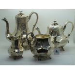 A Highly Decorative Plated Four Piece Tea Set, of panelled form allover leaf scroll engraved, with
