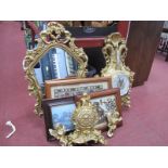 A Gilt Painted Wall Mirror, two clocks, two cherub pictures.