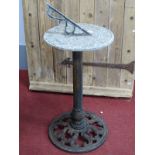 An Aluminium Sundial, 35.5cm diameter, on a later cast iron base, 81cm high,