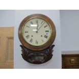 An Early XX Century Drop Bottom Wall Clock, in a stained mahogany carved case, with eight-day