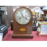 An Edwardian Mahogany Inlaid Mantel Clock, with a Silver dial, Arabic numerals, case with batwing