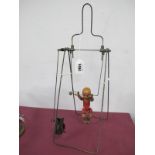 Vintage Toy, young child revolving around a trapeze frame, clockwork mechanism in need of some