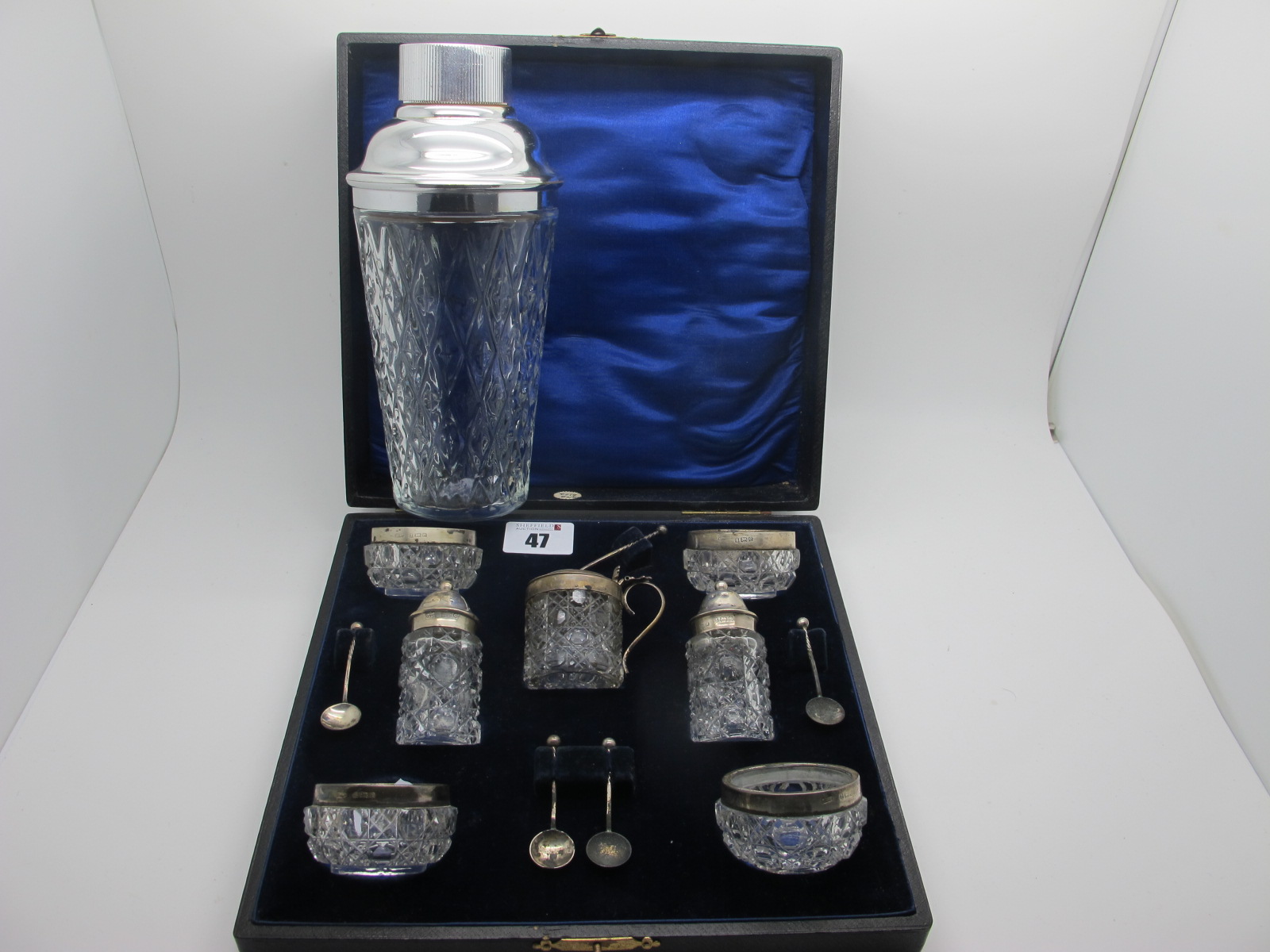 A Hallmarked Silver Cut Glass Seven Piece Cruet Set, Birmingham 1904, in origlan fitted case with