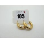 A Pair of Modern Hoop Earrings, of plain finish, stamped "375" (3grams).