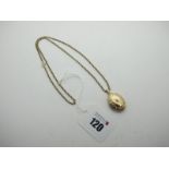 A Modern Oval Locket Pendant, stamped "375", on a 9ct gold belcher link chain (clasp damaged).