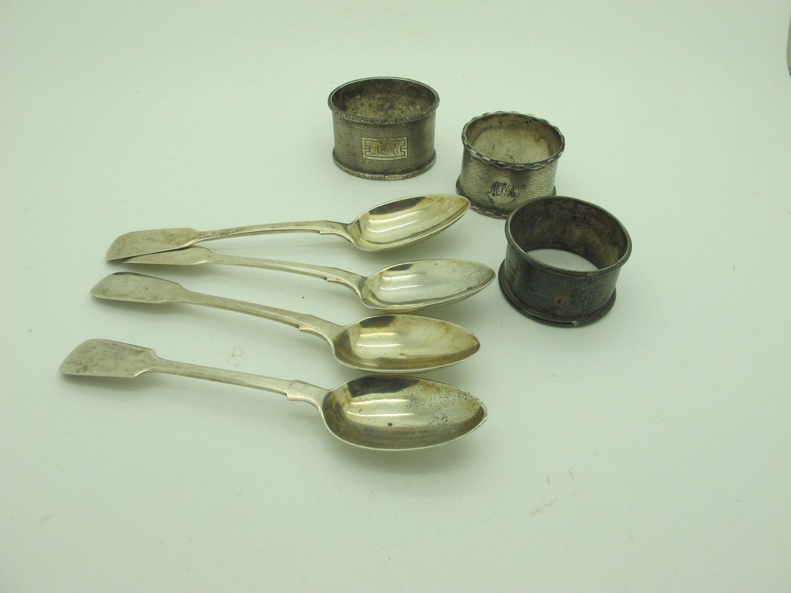 A Set of Three Hallmarked Silver Fiddle Pattern Teaspoons, London 1831; together with another