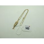 A 9ct Gold Novelty Articulated Fish Pendant, ona box link chain stamped "375" (total weight