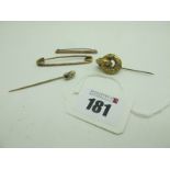 An "18ct Rolled Gold" Stock Pin, together with a decorative XIX Century brooch with long pin, a