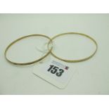 Two 9ct Gold Bangles, each with engraved decoration (total weight 7.5grams). (2)