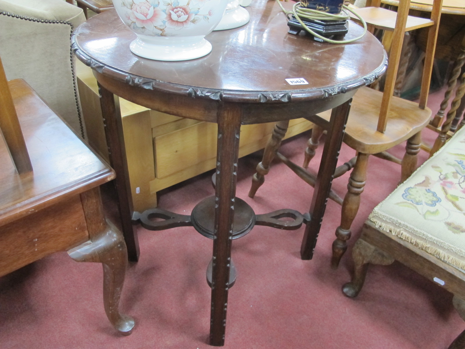 Edwardian Mahogany Occasional Table, with carved border to circular top, under shelf, 65cm