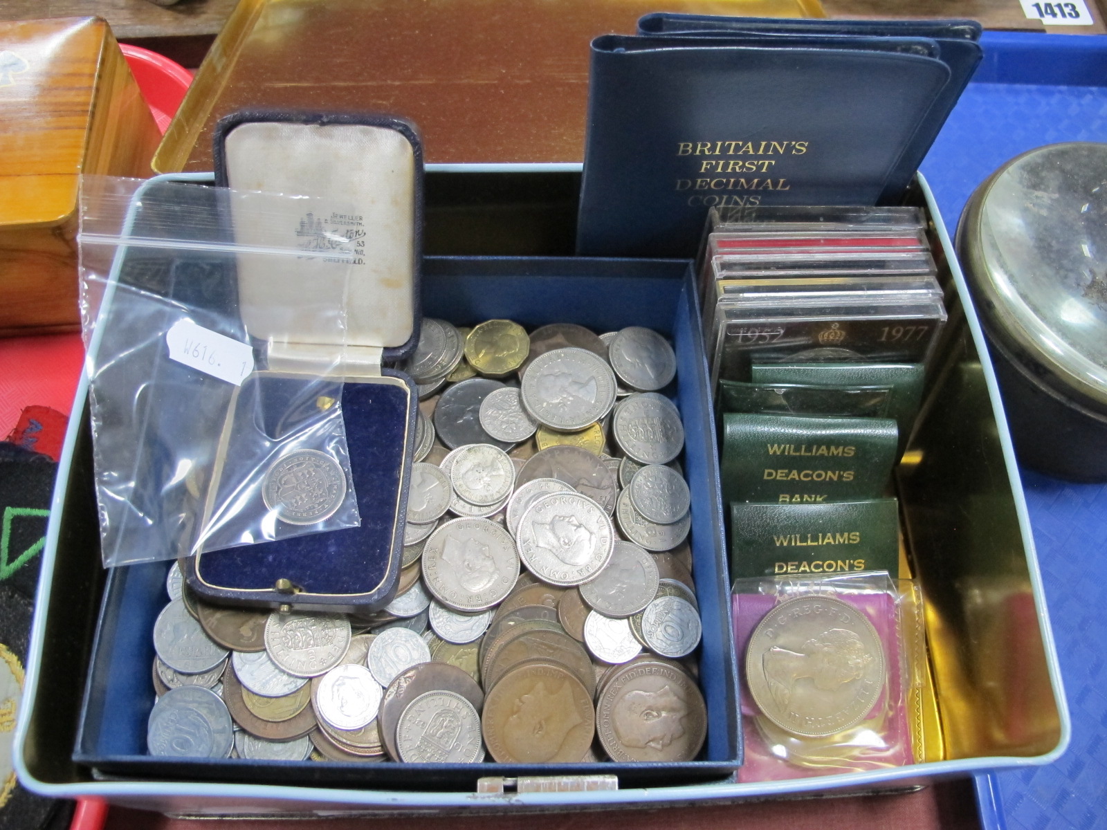 1819 Shilling, other coinage, in a tin.