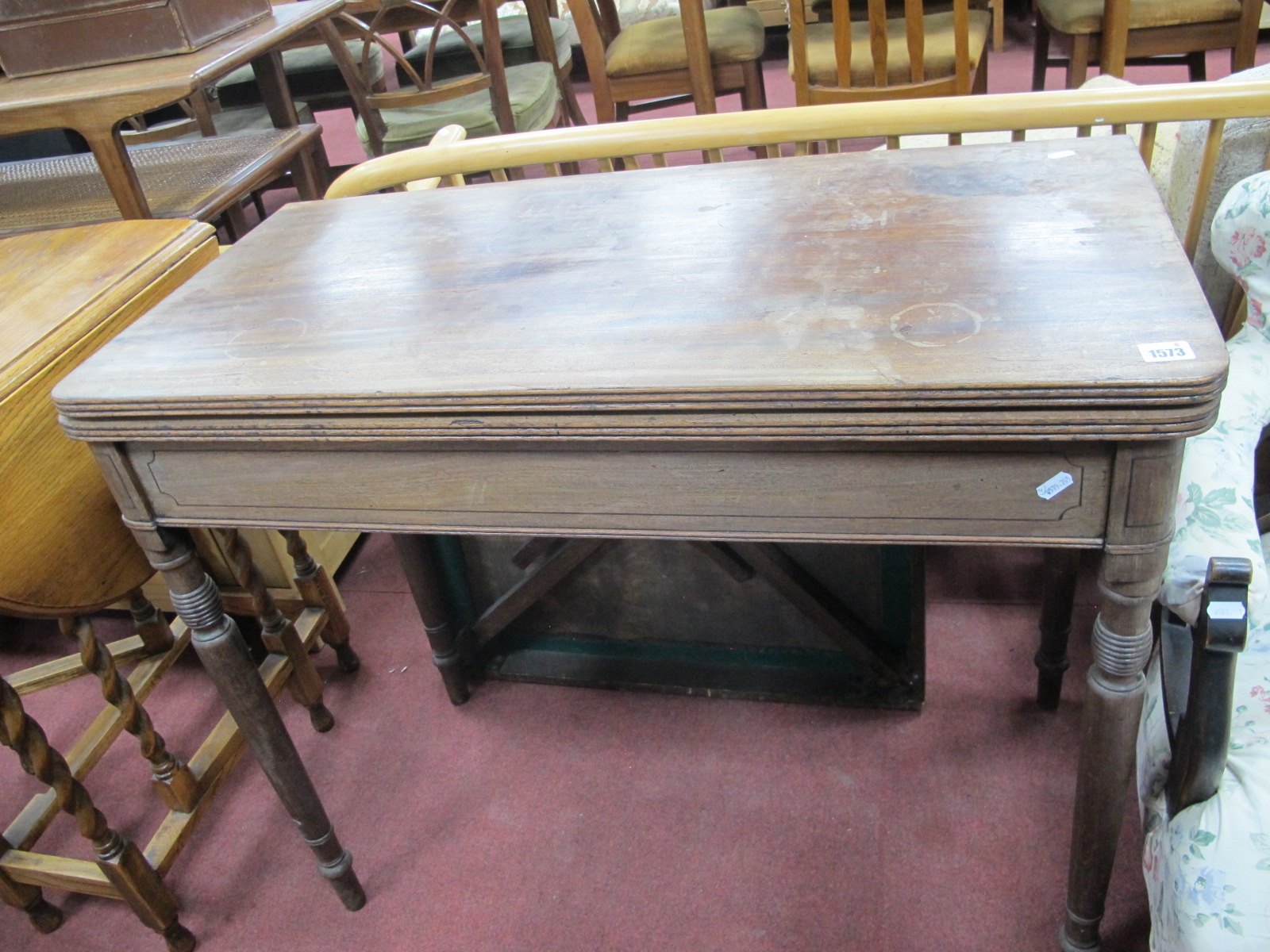 An Early XIX Century Mahogany Tea Table, with a fold over top, on turned supports, together with a