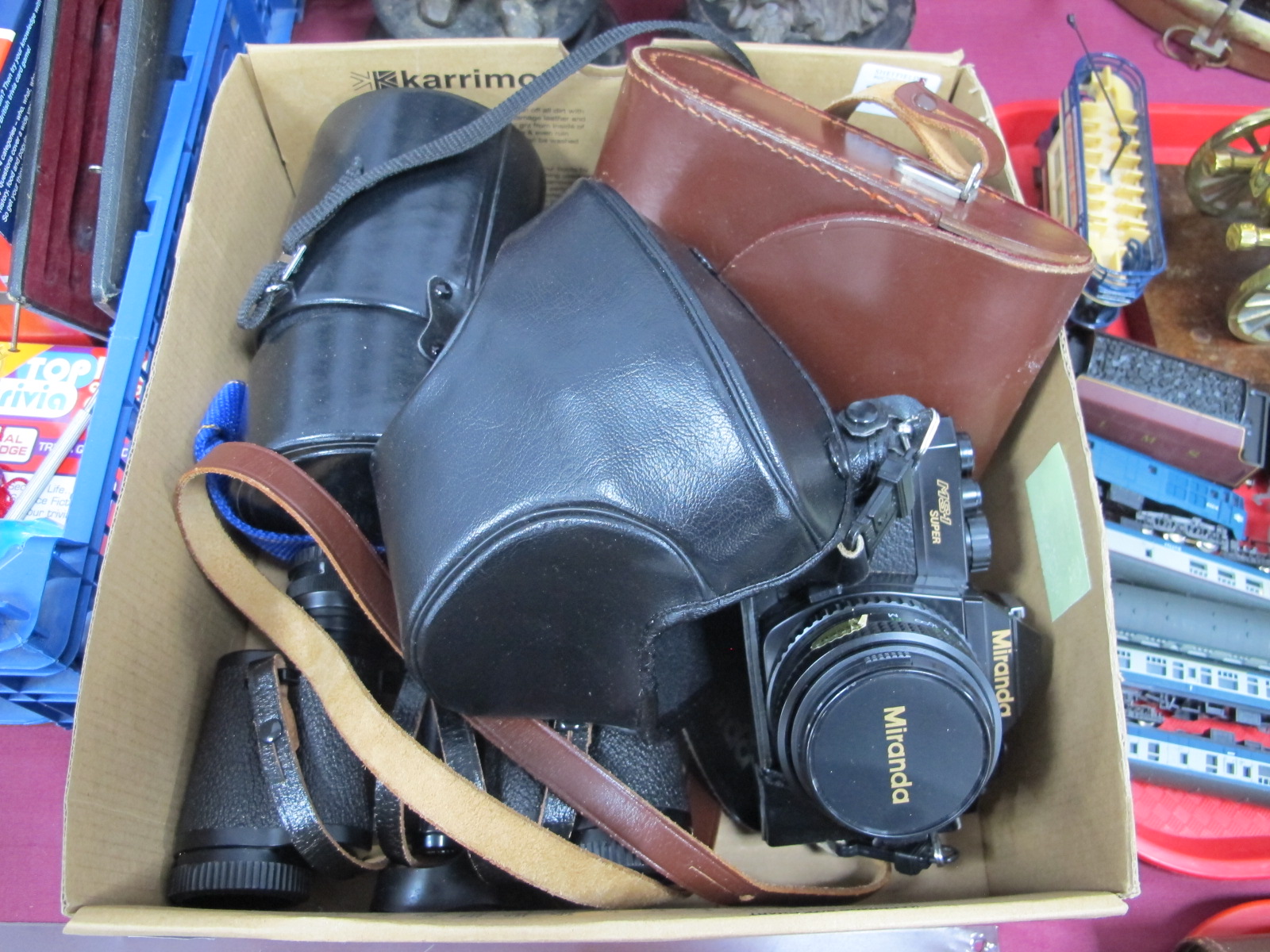 Miranda MS-1 Super Camera, having 50mm lens; Hanimex 500mm lens, Carl Zeiss 8 x 30 binoculars.