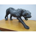 A Large Leather Model of a Panther, 24.5cm high, 56cm long.