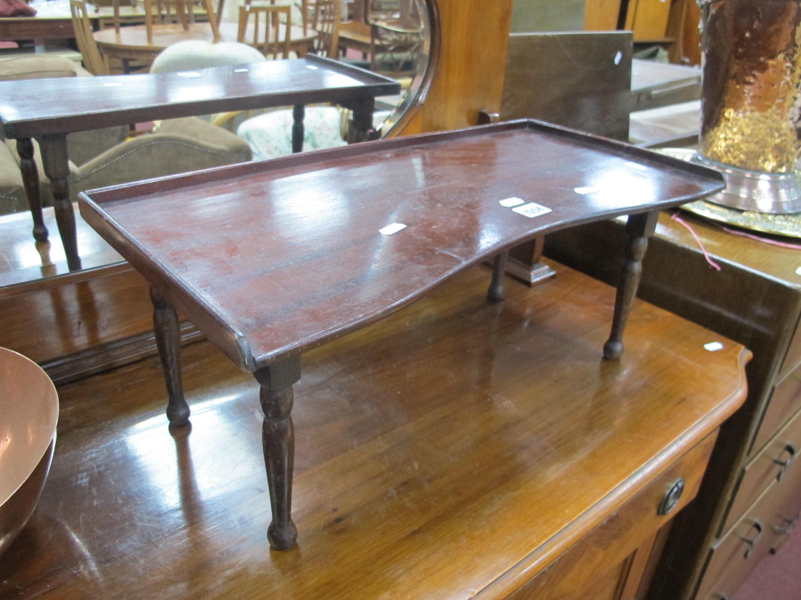 An Early XX Century Mahogany Over Bed Table, on turned supports.