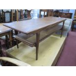 A Teak Wood Rectangular Shaped Coffee table, with a caned undershelf on tapering supports, 136cms in