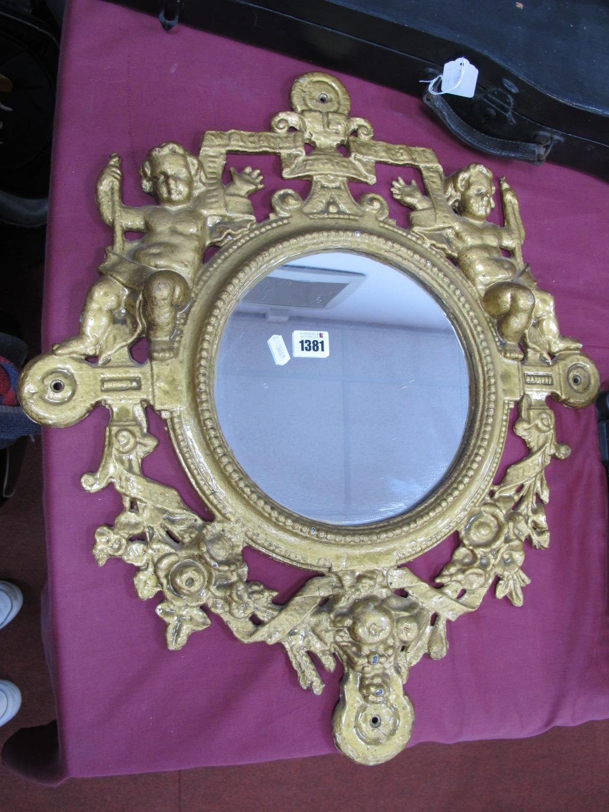 XIX Century Cast Iron Framed Circular Wall Mirror, decorated with cherubs and foliage with a