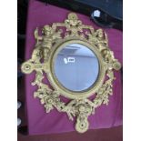 XIX Century Cast Iron Framed Circular Wall Mirror, decorated with cherubs and foliage with a