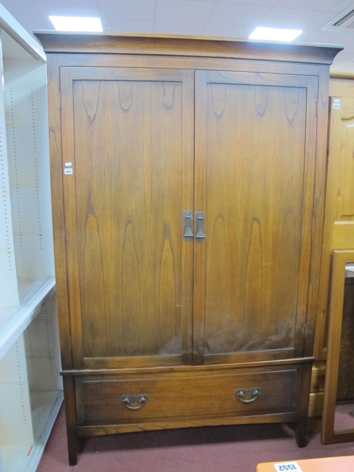 A Double Wardrobe, with curved pediment, twin doors over single drawer, 125cm wide.
