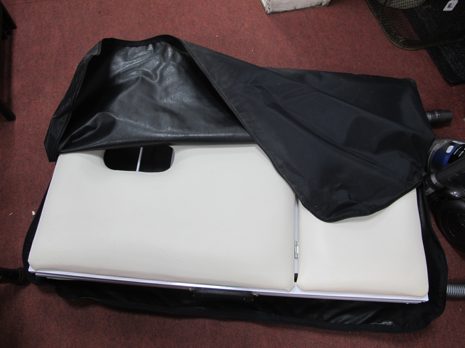 A Mercia Collection Folding Massage Table, in bag.