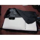 A Mercia Collection Folding Massage Table, in bag.