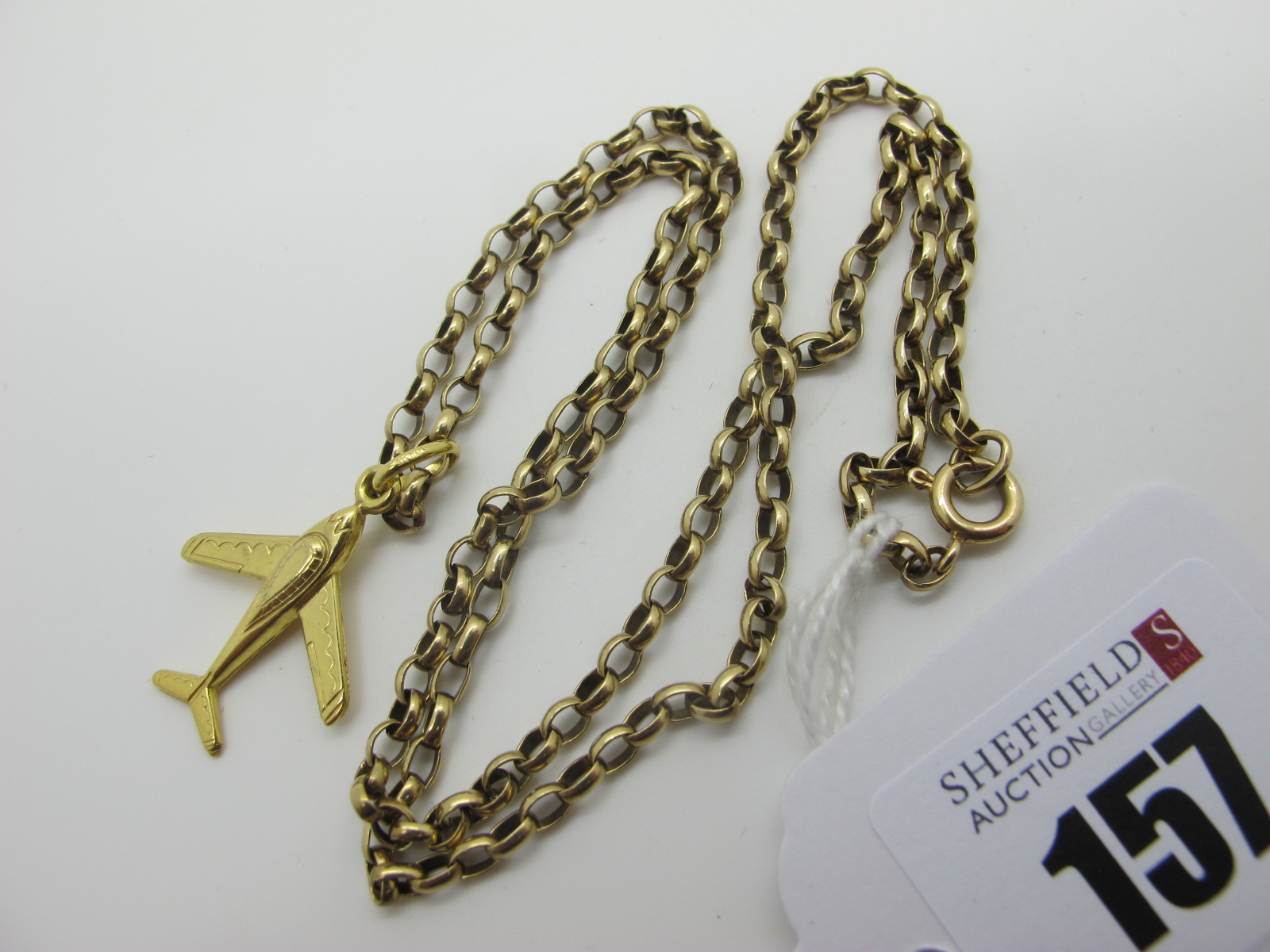 A 9ct Gold Belcher Link Chain, suspending a novelty aeroplane pendant, stamped "375" (10grams).