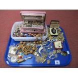 Assorted Costume Jewellery, including gilt metal chains, pendants, vintage bangle watch, fruit pit