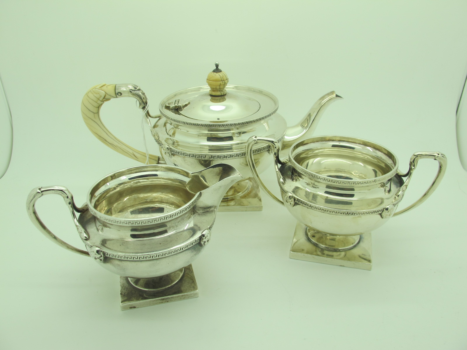 A Matched Hallmarked Silver Three Piece Bachelors Tea Set, teapot Messrs Hutton, Birmingham 1913 (