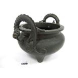 A Late XIX Century Chinese Bronze Censer, of circular frosted form, the handles in the form of