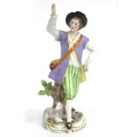 A XX Century Sitzendorf Style Porcelain Figure of a Shepherd Beside His Lamb, his right arm