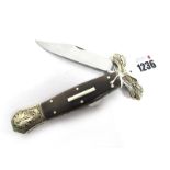 Stan Shaw; A Folding Dirk, with one locking blade, polished horn scales in the coffin shape,