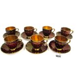 A Carlton Ware Pottery Part Coffee Service, the dark red grounds decorated with white enamel dots,