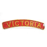 Railwayana; An Engine Plaque 'Victoria', painted red with gilt lettering and border, of curved form,