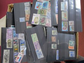 A Small Box Housing Thousands of Mint and Used Stamps, on stock cards in envelopes and plastic