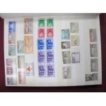 A Collection of Mint British Commonwealth Stamps Housed in a Green Stock Book, mainly GVI - QEII,