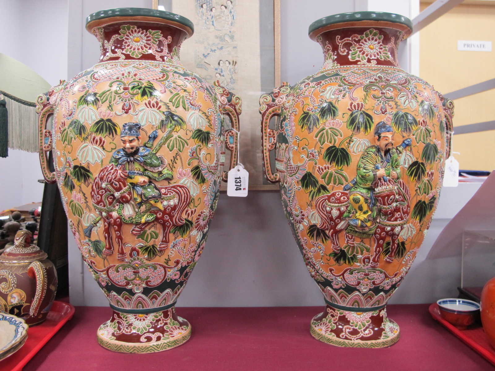 A Pair of Oriental Satsuma Vases, each with Chrysanthemum and scroll decoration, with Samurai