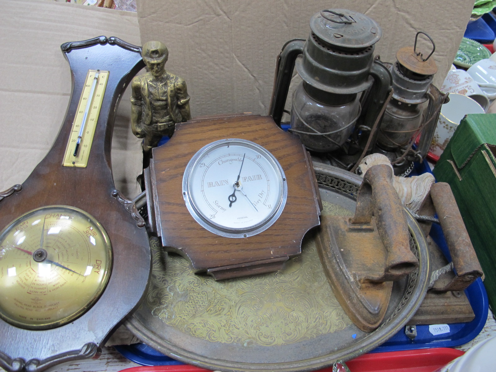 Two Hurricane Lamps, brass miner, barometers, flat irons, etc:- One Tray.