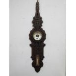 An Unusual Victorian Fretwork Wall Barometer/Thermometer, 73cm high, with brass thermometer.