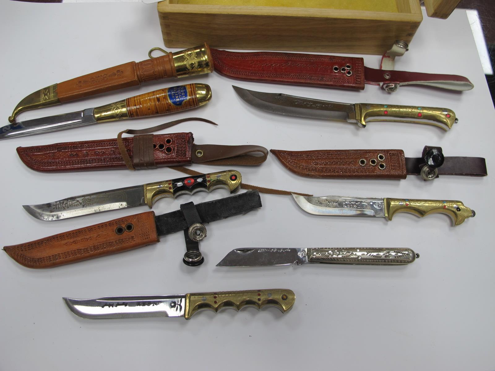 A Quantity of Asian Style Bowie Knives, all with sheaths, with ornate brass handles, some jeweled,