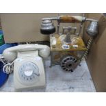 Continental Onyx Telephone, together with a cream Bakelite telephone. (2).