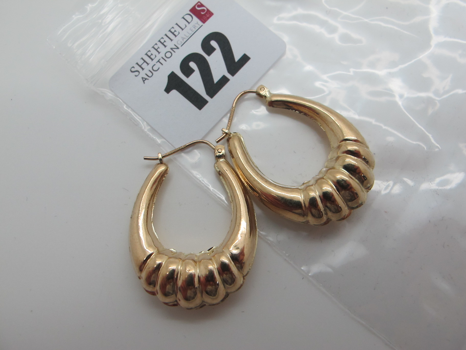 A Pair of Modern Earrings, stamped "375" (2.2grams).