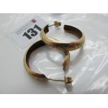 A Pair of Modern Hoop Earrings, stamped "375" (3.7grams).