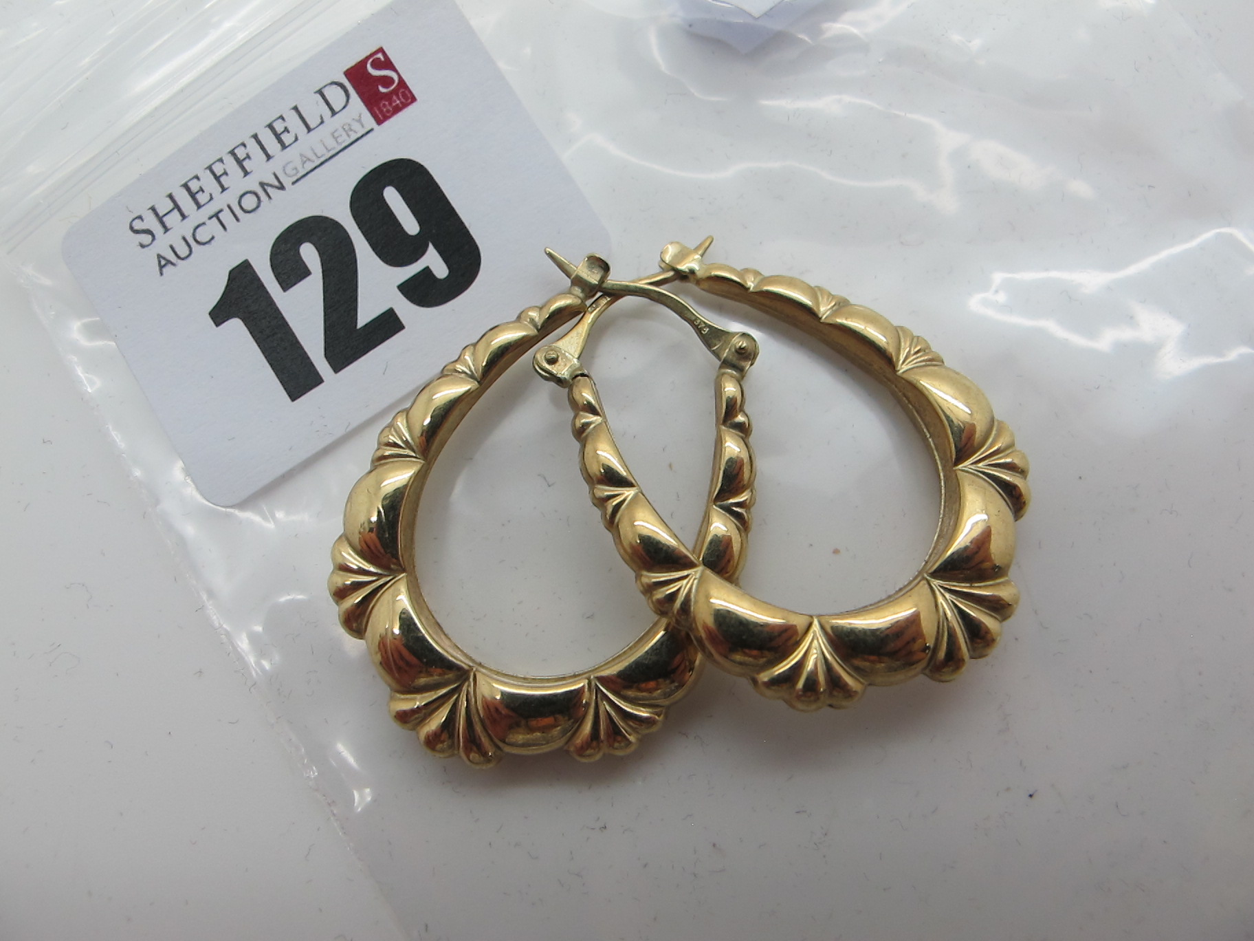 A Pair of Modern Earrings, stamped "375" (1.8grams).