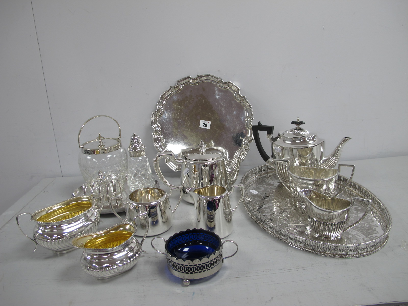 A Three Piece Plated Tea Set, of oval semi reeded form, together with hotel tea ware, oval plated