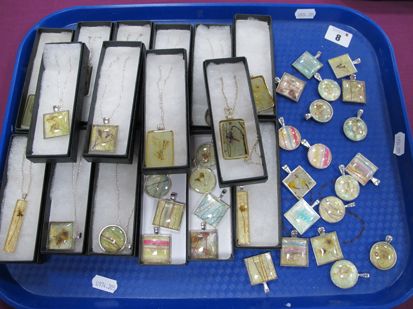 A Large Selection of Modern Resin (?) Pendants on Chains, some of foliate design, others of abstract