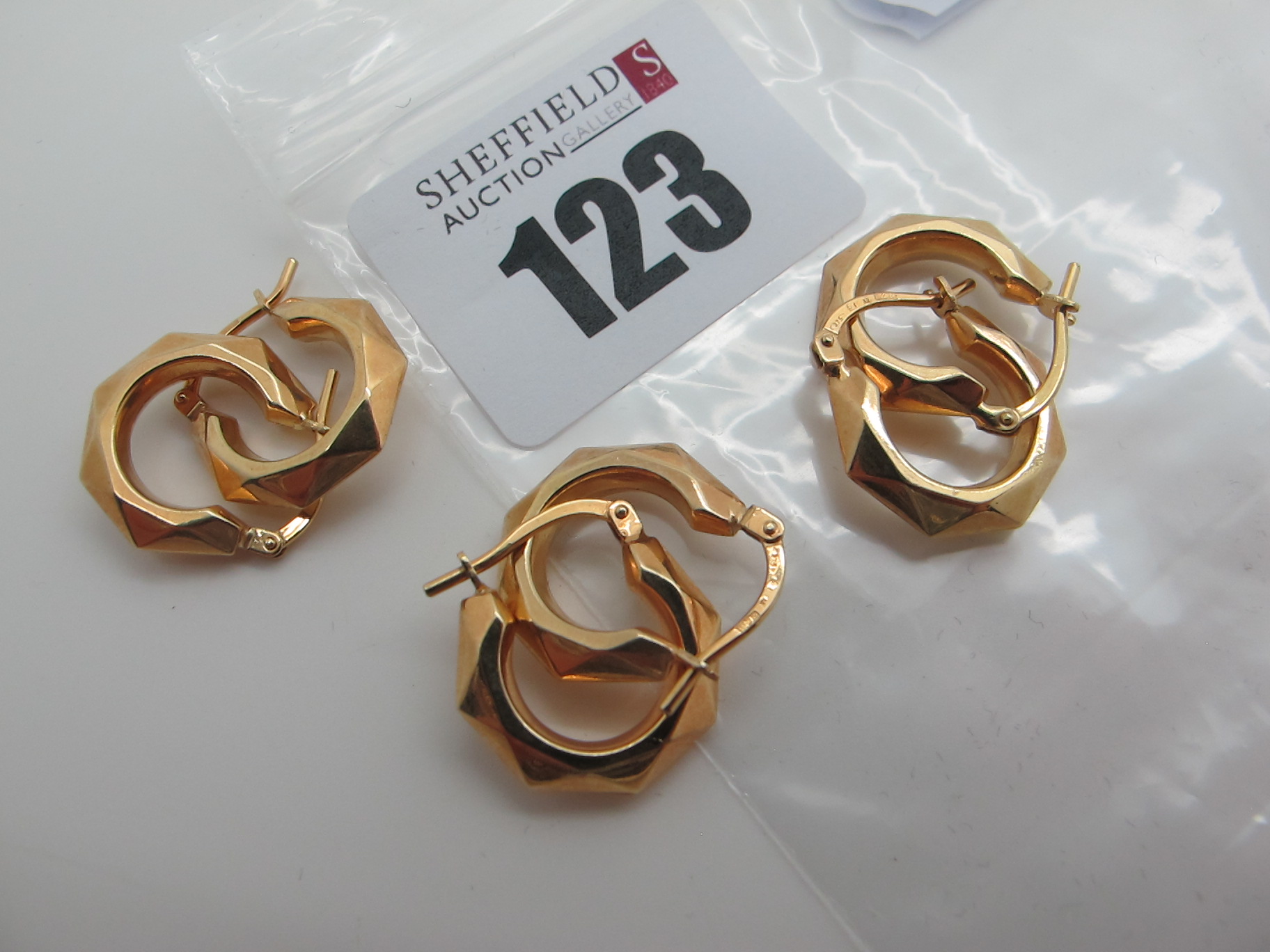 Three Pairs of Modern Hoop Earrings, (stamped "375" (3.8grams). (3)