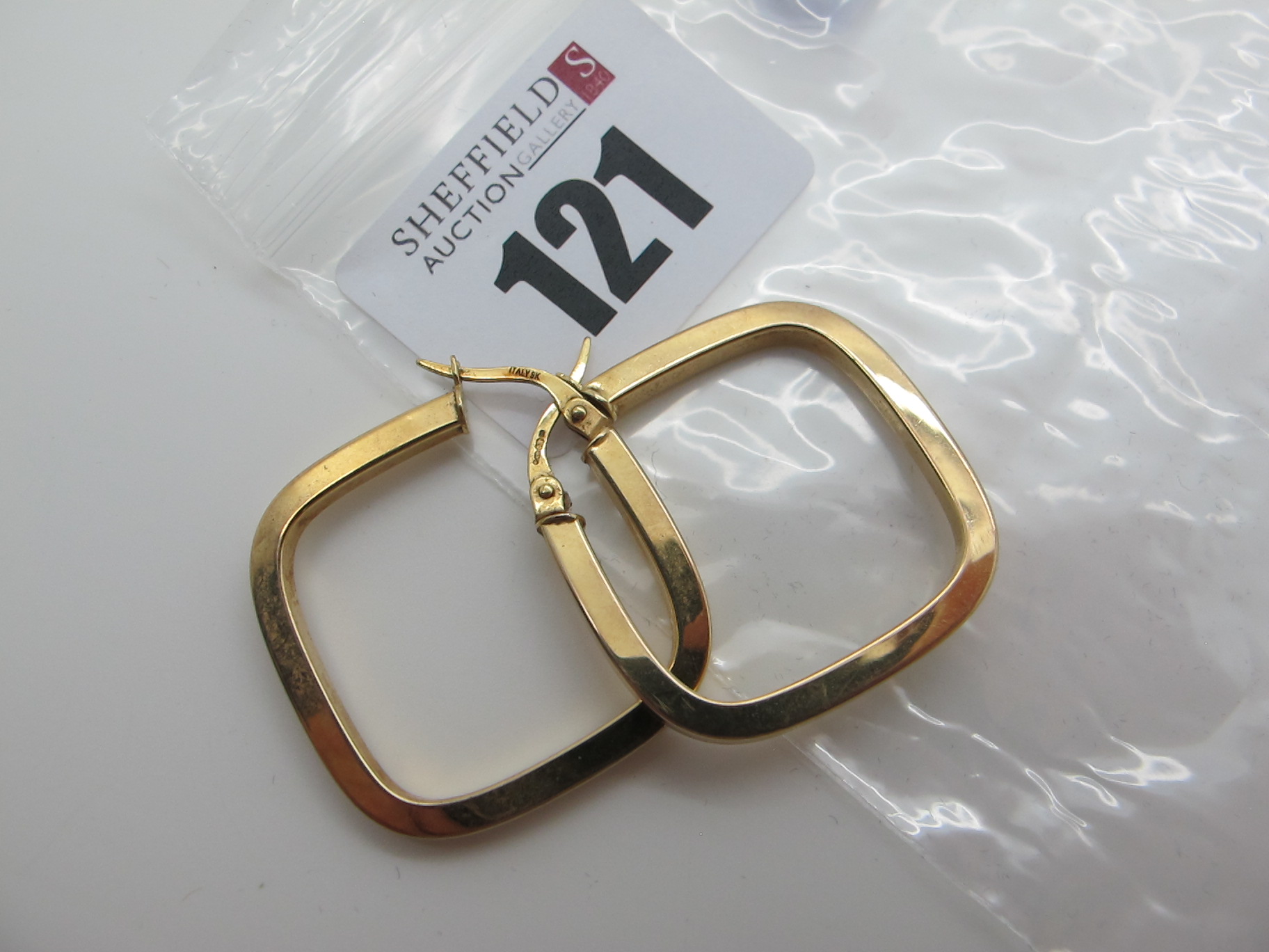 A Pair of Modern Earrings, stamped "375" (2.3grams).