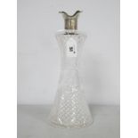 A Hallmarked Silver Mounted Cut Glass Decanter, Walker & Hall, Sheffield 1913, of tapering form with