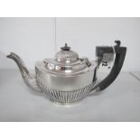 A Hallmarked Silver Bachelor's Tea Pot, JGLtd (marks rubbed), of oval semi reeded form (finial